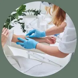 Provider caring for a patient during IV hydration therapy