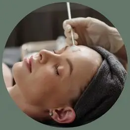 Woman receiving a professional facial skin treatment